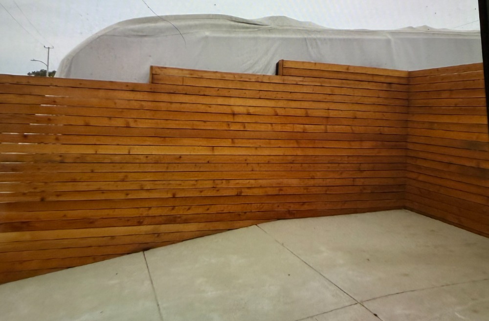 Horizontal wooden fence installation